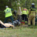 Kyrkbyn: Man fastklämd under träd